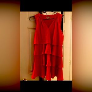 Coral colored summer dress.